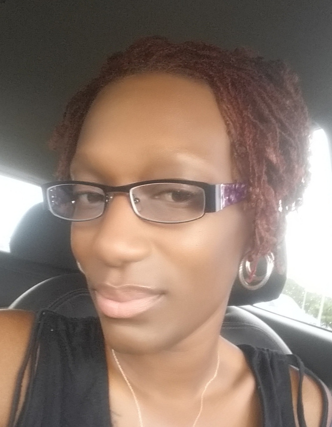 A headshot of alumna and breast cancer survivor N'kisha Roberts.