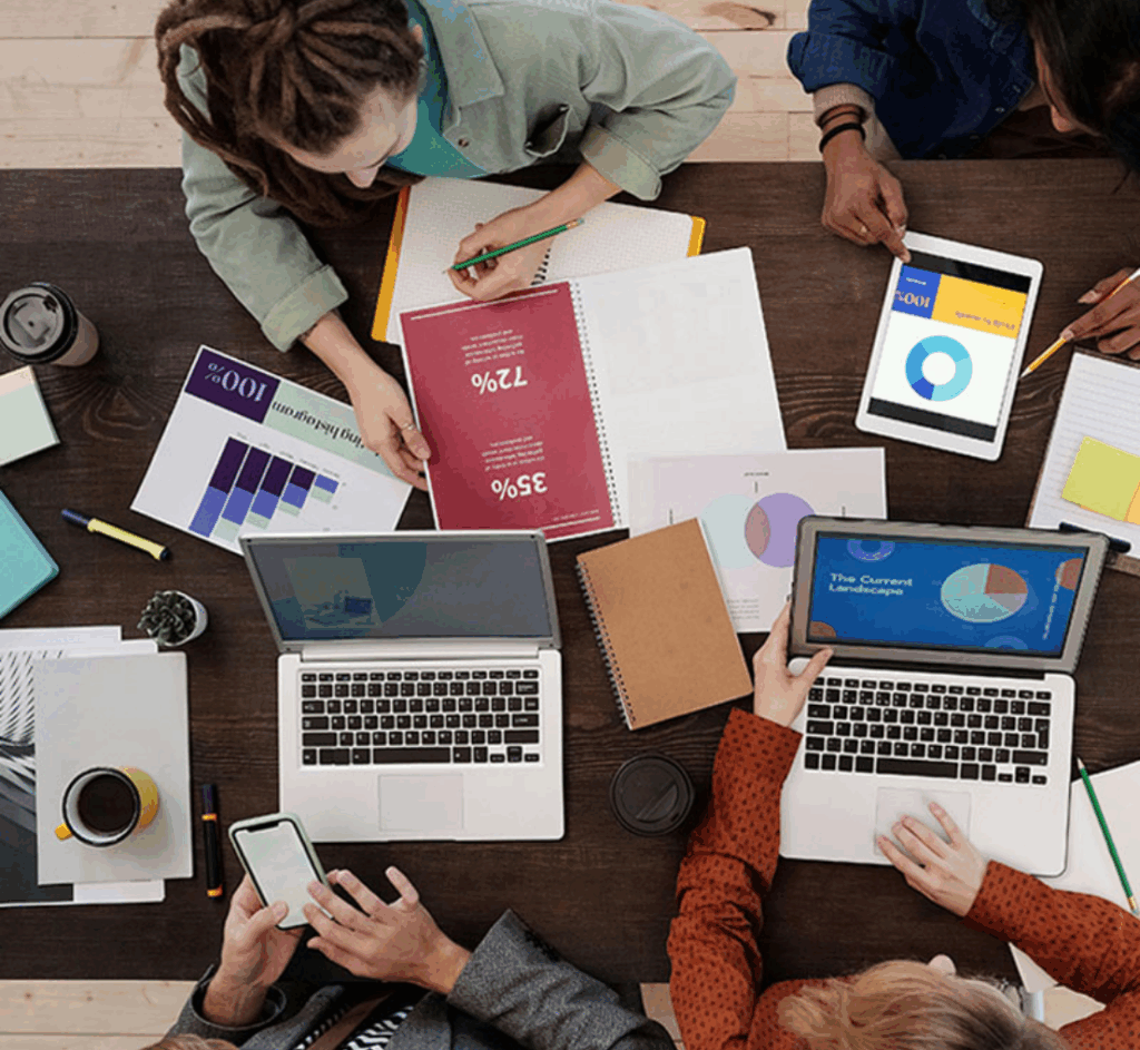 Students on laptops, in a study session.