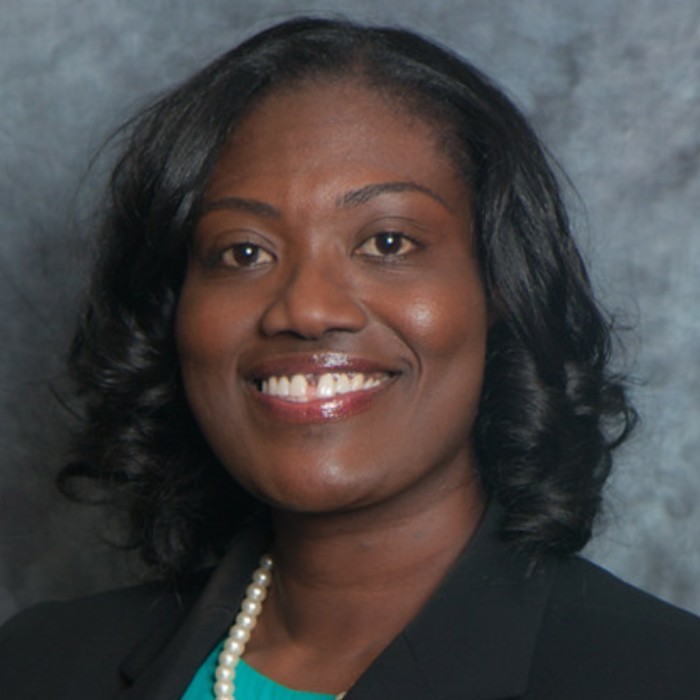 A professional headshot of Kim Azille, President of the SCEC Class of 1998 Alumni Association.