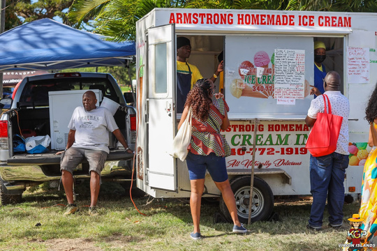 Alumni members in line at the Armstrong Homemade Ice Cream truck at the Agricultural Fair
