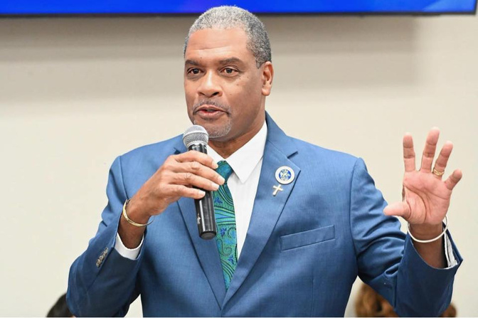 A photo of Senator Kurt Vialet, former principal of St. Croix Educational Complex, speaking at an event.